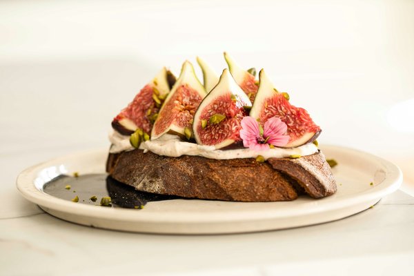 How can installing underfloor heating in your kitchen promote a warm, inviting atmosphere for healthy cooking?